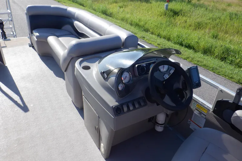 Slide: The Image of 2009 Premier 225 Sunsation LTD pontoon boat interior with steering console and seating. - 37