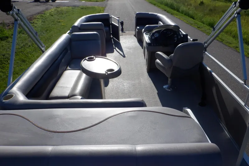 Slide: The Image of 2009 Premier 225 Sunsation LTD pontoon boat interior with seating and steering console. - 39