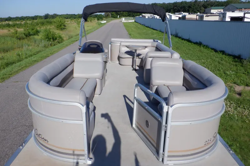 Slide: The Image of 2009 Premier 225 Sunsation LTD pontoon boat with spacious seating and canopy on a sunny day. - 40