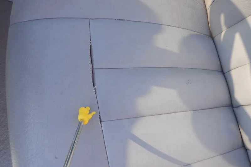 Slide: The Image of Torn seat upholstery in 2009 Premier 225 Sunsation LTD boat. - 41