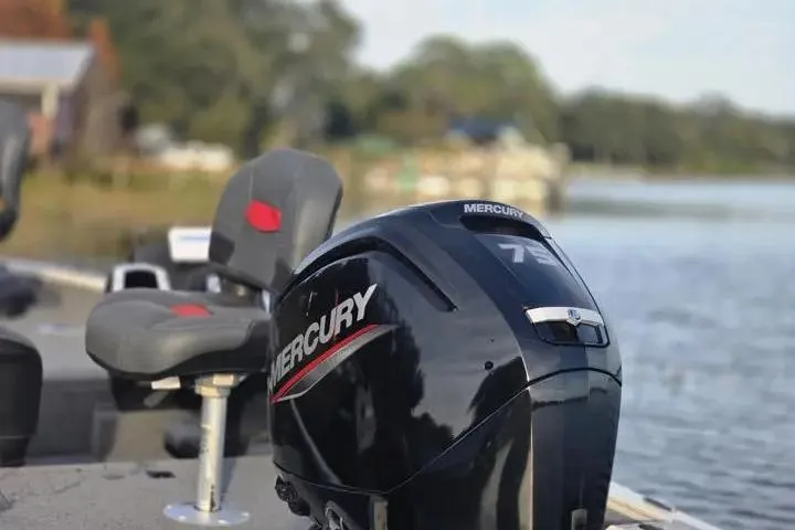 Slide: The Image of 2025 Tracker Pro Team 175 Crappie Edition with Mercury engine on a serene lake. - 11
