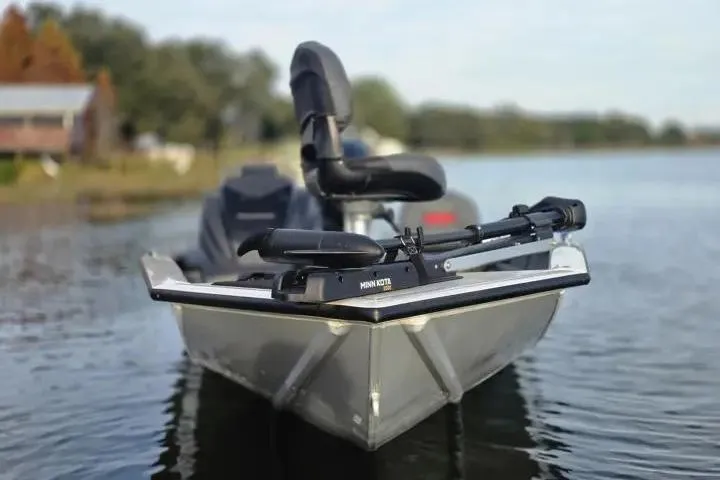 Slide: The Image of 2025 Tracker Pro Team 175 Crappie Edition boat on calm lake water. - 5