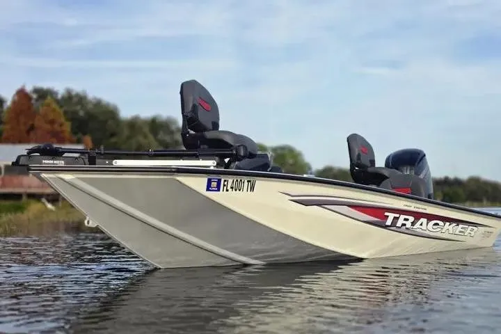 Slide: The Image of 2025 Tracker Pro Team 175 Crappie Edition boat on calm water. - 7