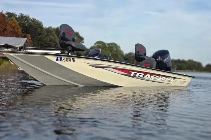 Slide: The Image of 2025 Tracker Pro Team 175 Crappie Edition boat on calm lake water. - 8