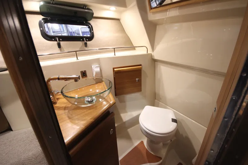 Slide: The Image of Luxurious 2026 Ranger Tugs R-27 boat bathroom with modern fixtures and elegant design. - 21