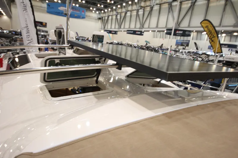 Slide: The Image of 2026 Ranger Tugs R-27 boat with solar panel at indoor exhibition. - 26