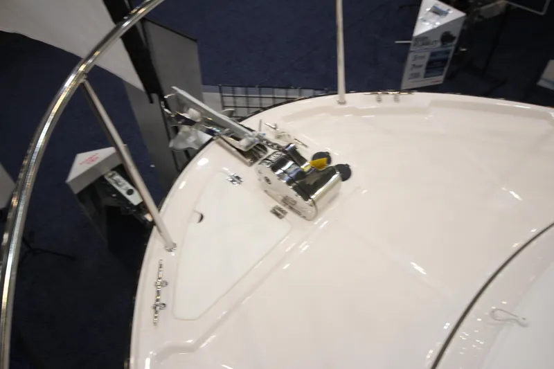 Slide: The Image of 2026 Ranger Tugs R-27 boat deck with anchor system, featuring sleek design and stainless steel fittings. - 27