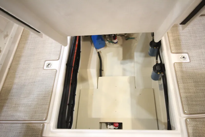 Slide: The Image of Engine compartment of 2026 Ranger Tugs R-27 boat, showcasing interior components and layout. - 9