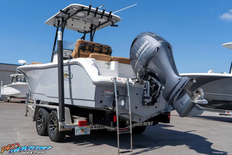 Slide: The Image of 2021 Sea Hunt Ultra 229 boat with Yamaha outboard motor on trailer. - 11