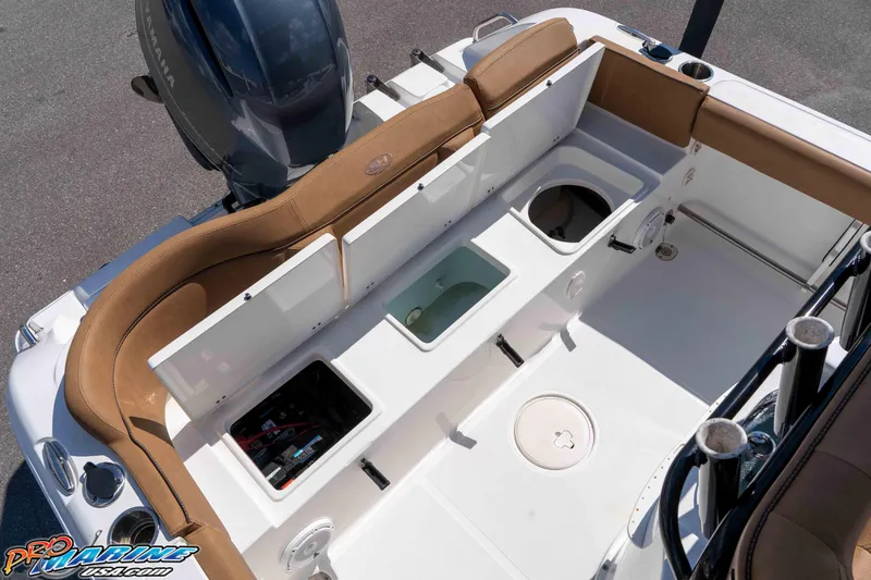 Slide: The Image of 2021 Sea Hunt Ultra 229 boat interior with seating and storage compartments. - 21