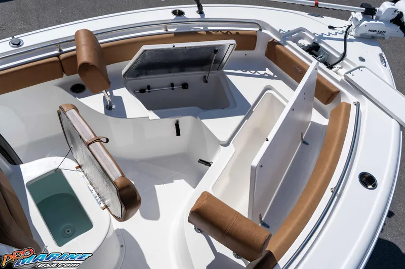 Slide: The Image of 2021 Sea Hunt Ultra 229 boat interior with seating and storage compartments. - 31