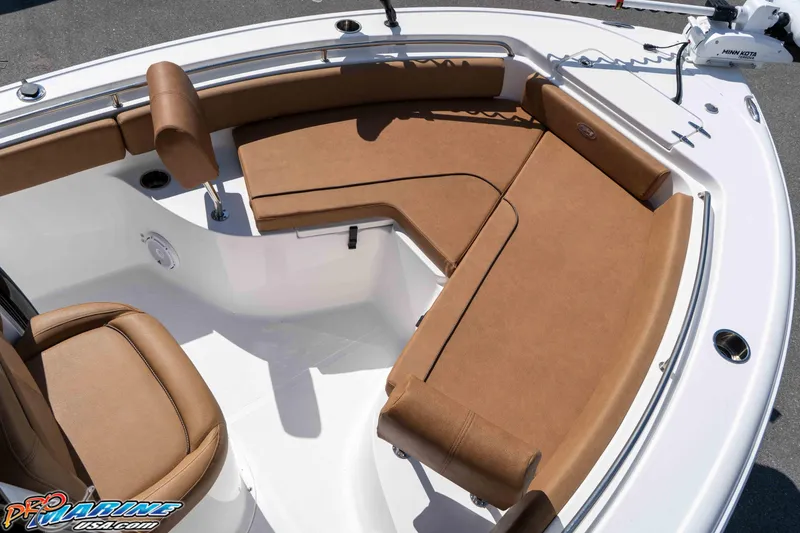 Slide: The Image of 2021 Sea Hunt Ultra 229 boat interior with tan seating and modern design. - 32