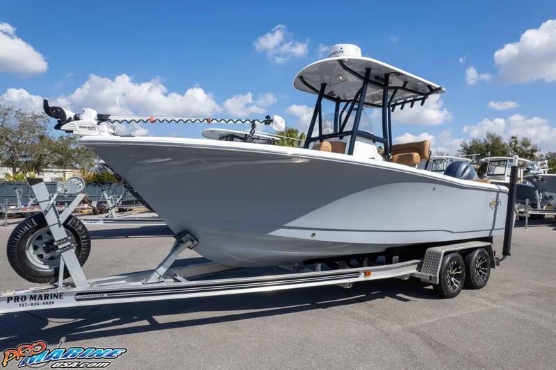 Slide: The Image of 2021 Sea Hunt Ultra 229 boat on trailer under clear blue sky. - 35
