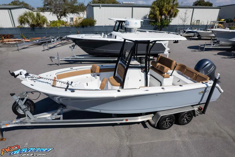 Slide: The Image of 2021 Sea Hunt Ultra 229 boat on trailer, featuring sleek design and spacious seating. - 40