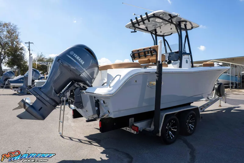 Slide: The Image of 2021 Sea Hunt Ultra 229 boat with Yamaha engine on trailer, parked outdoors. - 46