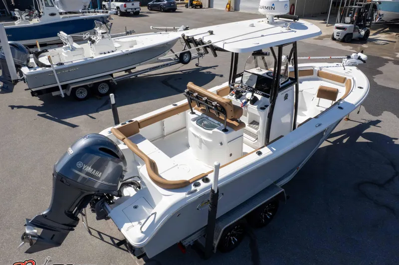 Slide: The Image of 2021 Sea Hunt Ultra 229 boat with Yamaha engine on trailer in marina. - 47
