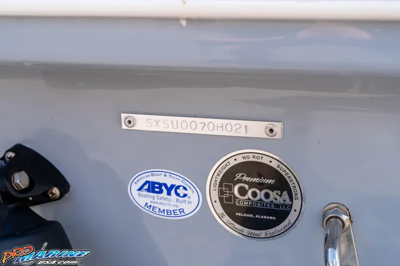 Slide: The Image of 2021 Sea Hunt Ultra 229 boat with ABYC and Coosa Composites labels. - 7