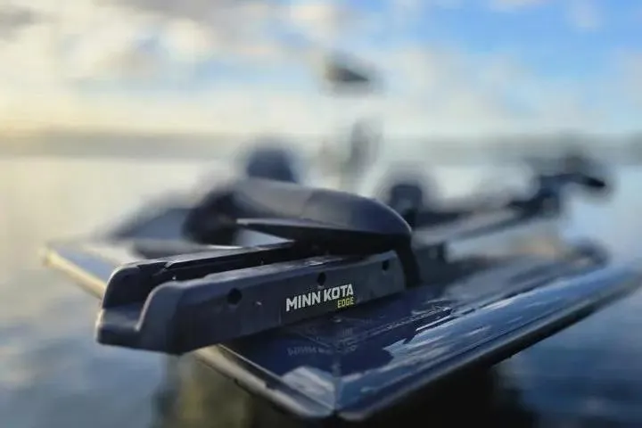 Slide: The Image of 2020 Tracker Pro Team 175 TF boat with Minn Kota Edge trolling motor on calm water. - 16