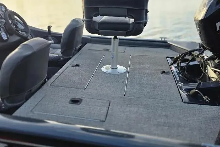 Slide: The Image of 2020 Tracker Pro Team 175 TF boat interior with seating and storage compartments. - 22