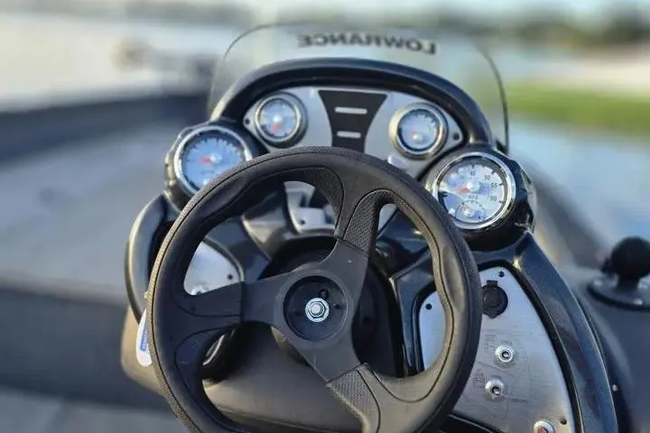 Slide: The Image of 2020 Tracker Pro Team 175 TF boat dashboard with steering wheel and gauges. - 28
