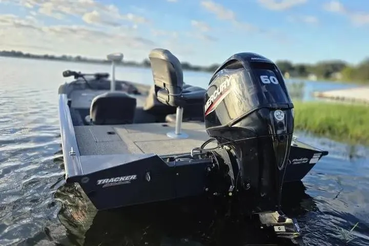 Slide: The Image of 2020 Tracker Pro Team 175 TF boat with Mercury 60 engine on a serene lake. - 7
