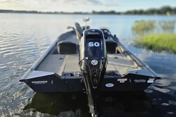 Slide: The Image of 2020 Tracker Pro Team 175 TF boat with Mercury 60 engine on a serene lake. - 8