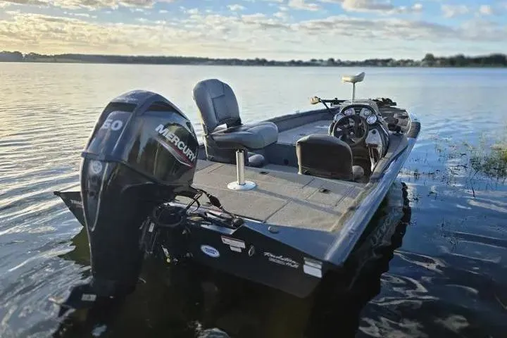 Slide: The Image of 2020 Tracker Pro Team 175 TF boat with Mercury engine on a serene lake. - 9