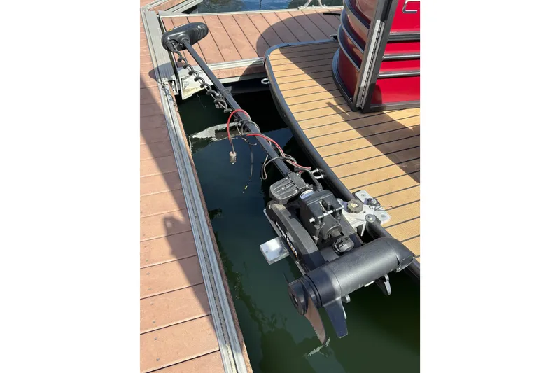 Slide: The Image of 2018 Coach Pontoons 230 RF with trolling motor at dock. - 15
