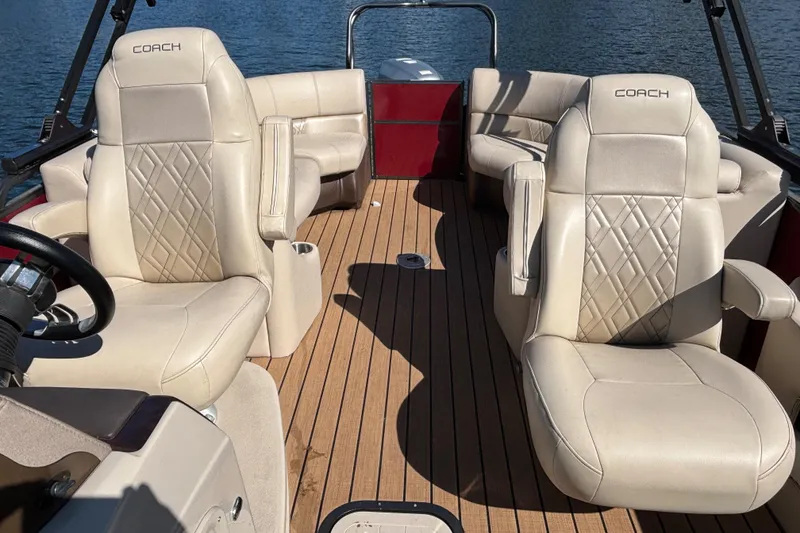 Slide: The Image of 2018 Coach Pontoons 230 RF interior with luxurious seating and SeaDek flooring. - 9
