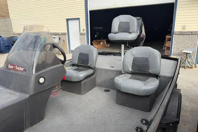Slide: The Image of 2020 Tracker Bass Tracker Classic XL boat with three gray seats and steering console. - 6