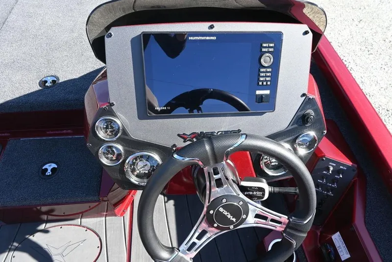 Slide: The Image of 2026 Vexus AVX 2100 boat dashboard with steering wheel and digital display. - 8