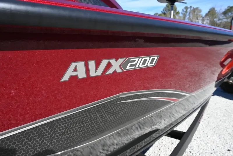 Slide: The Image of 2026 Vexus AVX 2100 boat, red exterior with sleek design details. - 9
