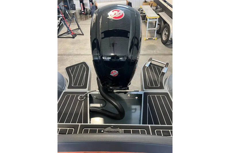 Slide: The Image of 2024 Highfield Sport 560 boat engine and deck in a workshop setting. - 8