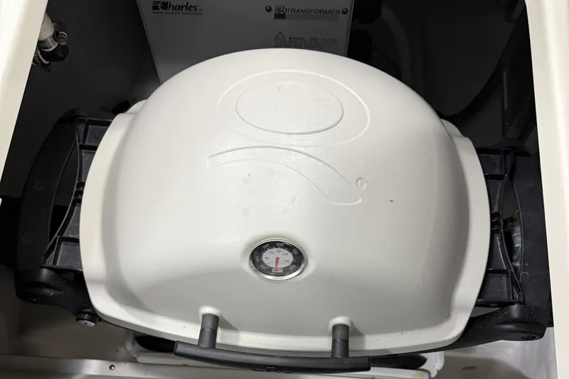 Slide: The Image of White grill with temperature gauge on 2021 Sabre 42 Fly Bridge yacht. - 11