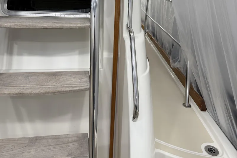 Slide: The Image of Staircase and railing on 2021 Sabre 42 Fly Bridge yacht interior. - 13