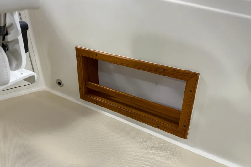 Slide: The Image of Wooden-framed compartment on 2021 Sabre 42 Fly Bridge interior. - 19