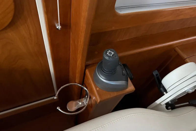 Slide: The Image of Interior of 2021 Sabre 42 Fly Bridge with joystick control and cup holder. - 27