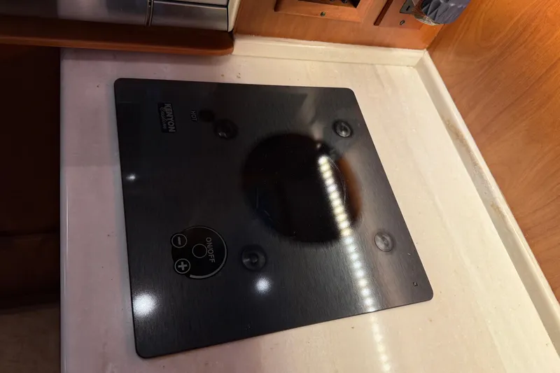 Slide: The Image of Kenyon cooktop on Sabre 42 Fly Bridge yacht, 2021 model, sleek black design. - 33