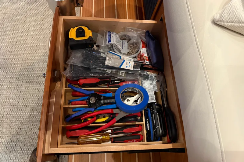 Slide: The Image of Drawer with tools and supplies on a 2021 Sabre 42 Fly Bridge yacht. - 36