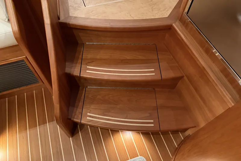 Slide: The Image of Wooden interior stairs on a 2021 Sabre 42 Fly Bridge yacht. - 48