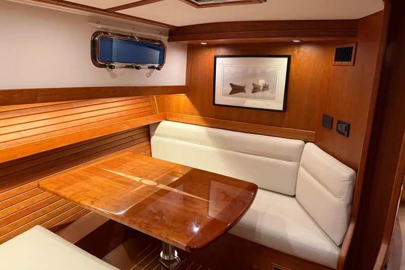 Slide: The Image of Elegant interior of 2021 Sabre 42 Fly Bridge with wood finish and cozy seating. - 50