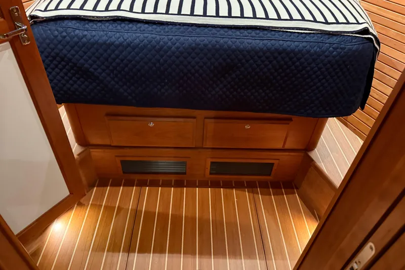 Slide: The Image of Interior of 2021 Sabre 42 Fly Bridge with wooden flooring and bed. - 54