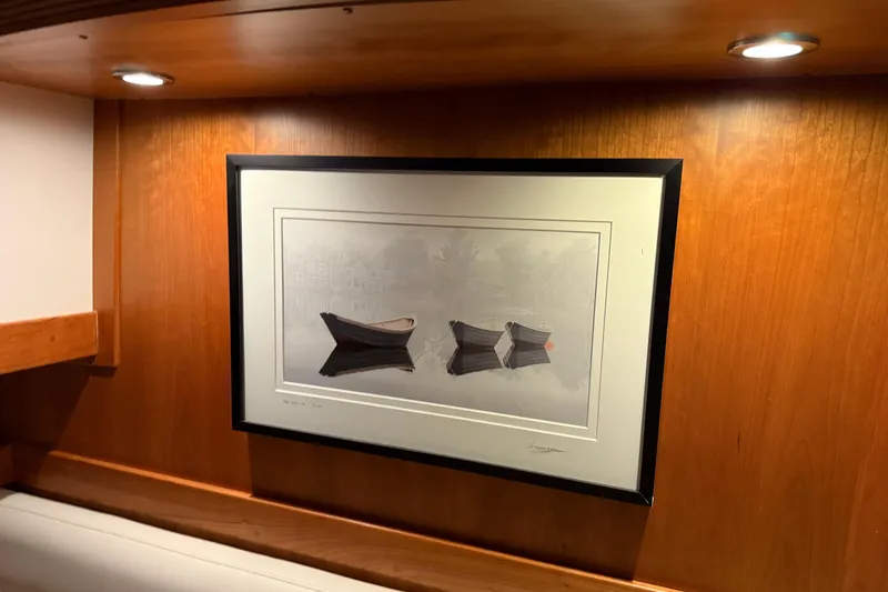 Slide: The Image of Framed artwork on wooden wall inside 2021 Sabre 42 Fly Bridge yacht interior. - 63