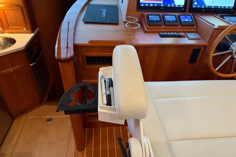 Slide: The Image of Interior of 2021 Sabre 42 Fly Bridge yacht with helm station and seating. - 66