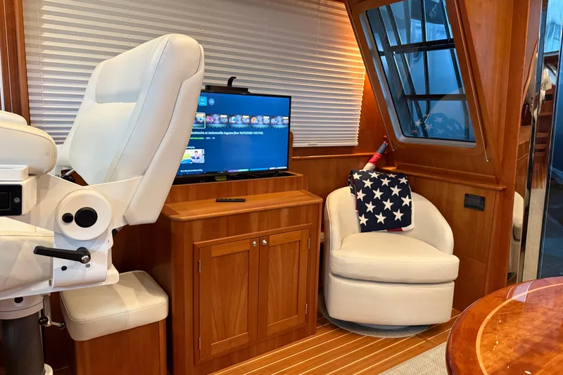 Slide: The Image of Luxurious interior of 2021 Sabre 42 Fly Bridge yacht with plush seating and entertainment system. - 68