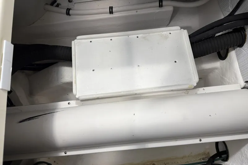 Slide: The Image of Engine compartment of 2021 Sabre 42 Fly Bridge with visible wiring and components. - 79