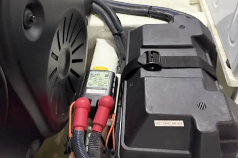 Slide: The Image of Engine compartment of 2021 Sabre 42 Fly Bridge with battery and wiring. - 87