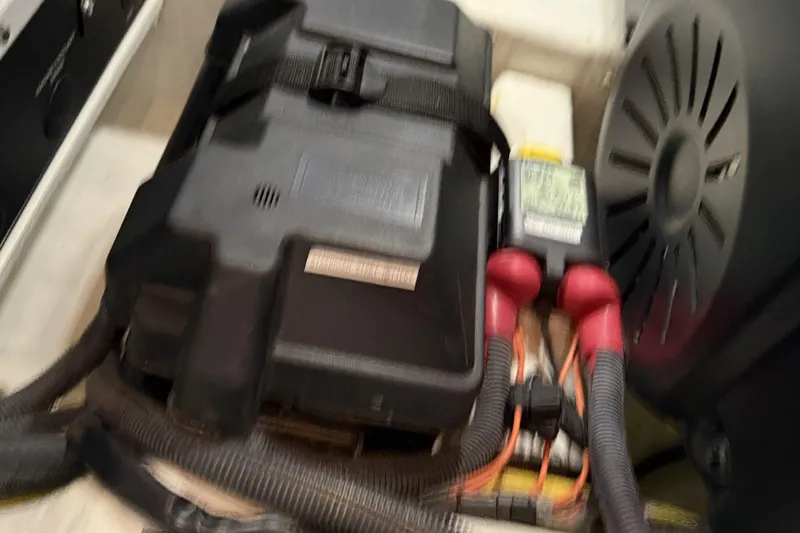 Slide: The Image of Engine compartment of 2021 Sabre 42 Fly Bridge with battery and wiring. - 88