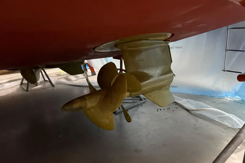 Slide: The Image of Propeller and rudder of 2021 Sabre 42 Fly Bridge boat in dry dock. - 89