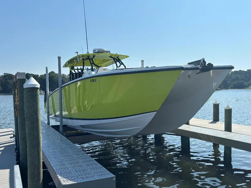 Slide: The Image of Bright yellow 2020 Prowler 42 boat docked on a sunny day. - 3